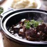 Slow cooker cube steak with gravy in a cozy kitchen setting.